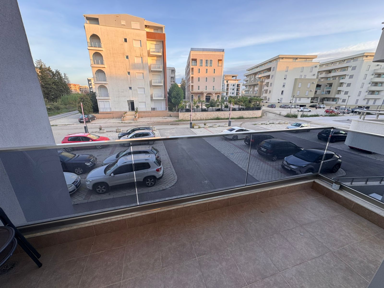 Spacious tiled balcony with glass railing in Ulcinj, Montenegro&mdash;prime views, ideal investment. Listed by montenegro-listings.me, ekosphere doo.