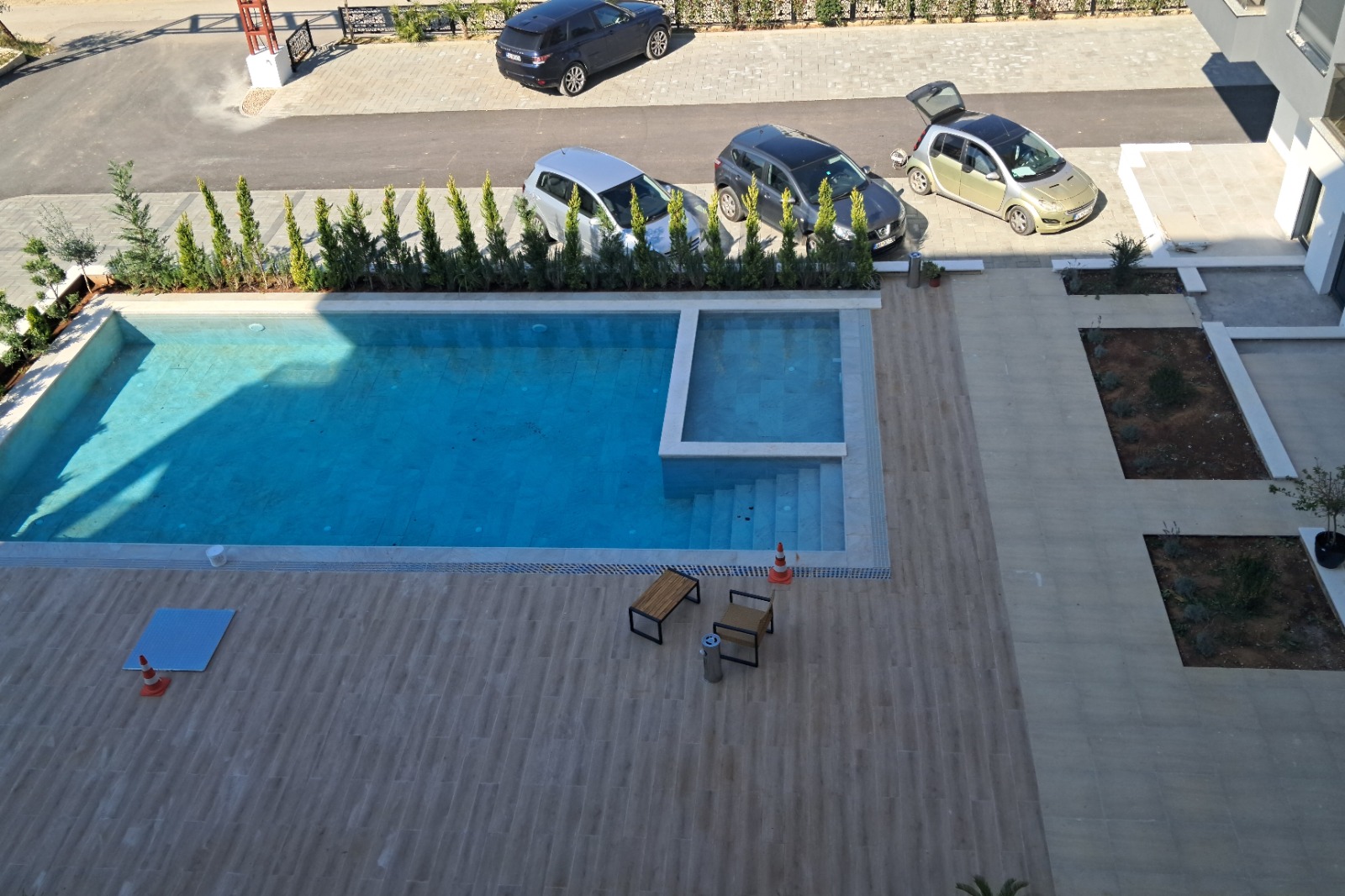 Luxury Ulcinj real estate: tiled patio, twin pools, stylish seating. Secure parking & privacy. montenegro-listings.me by ekosphere doo.