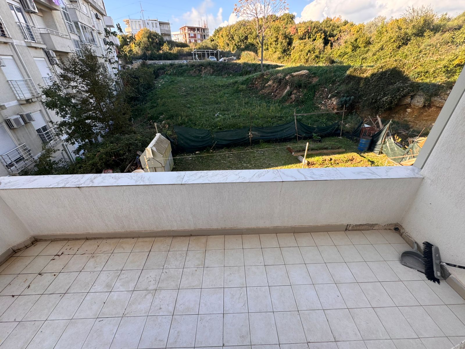 Discover investment potential with this Ulcinj property&mdash;a tiled balcony offering green yard views. Exclusive at montenegro-listings.me.