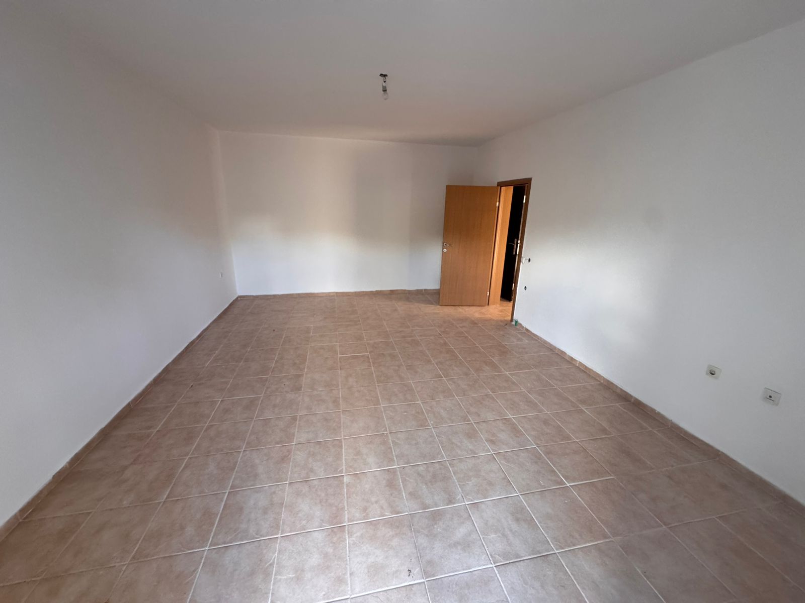 Spacious, sunlit room with elegant beige tiles and crisp white walls&mdash;ideal Ulcinj investment property from ekosphere doo on montenegro-listings.me.