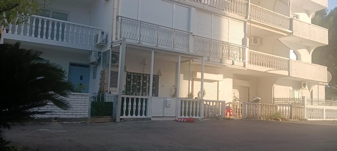 Elegant white multi-story residence in Ulcinj with balconies, private courtyard, and secure entry. Offered by montenegro-listings.me.