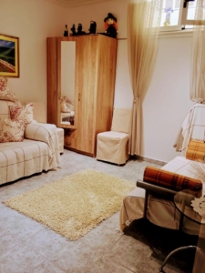 Bright, stylish Ulcinj living room with tile floors, beige sofas, and modern furnishings—prime investment on montenegro-listings.me.