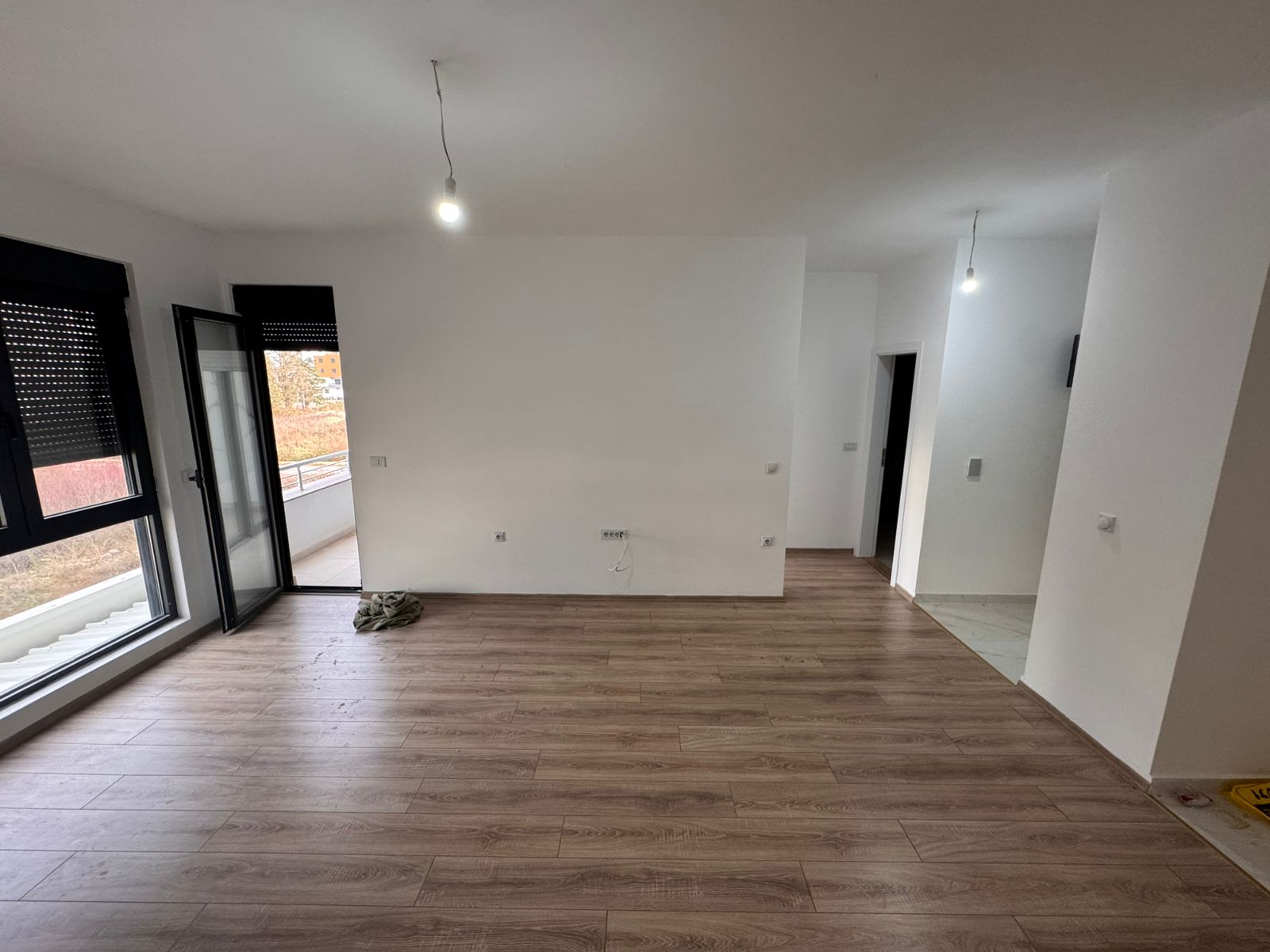 Bright, modern Ulcinj apartment with premium wood floors, balcony, and large windows. Exclusive on montenegro-listings.me by ekosphere doo.