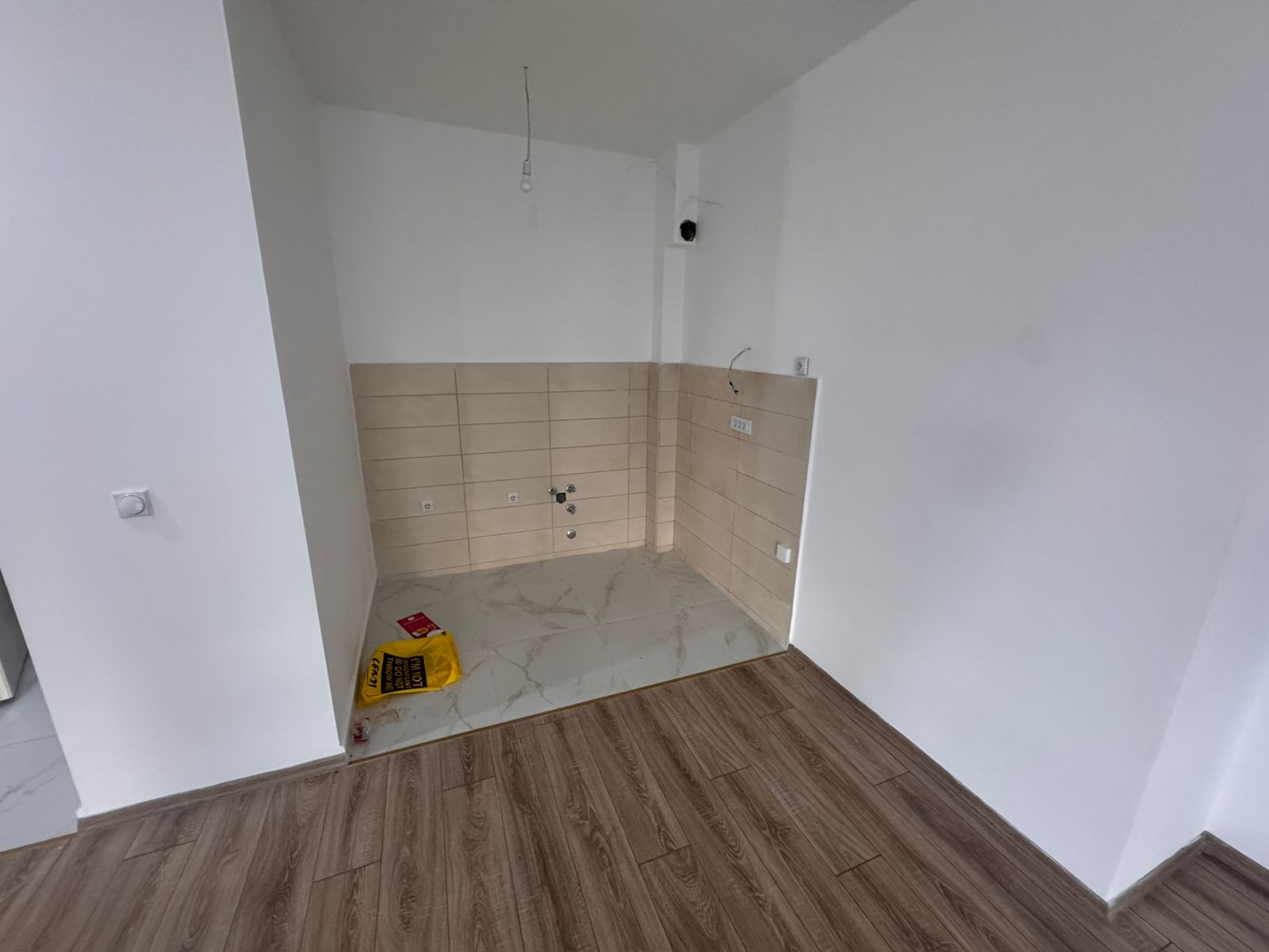 Spacious Ulcinj investment property with tiled kitchen area, utilities ready, modern flooring. Exclusive on montenegro-listings.me by ekosphere doo.