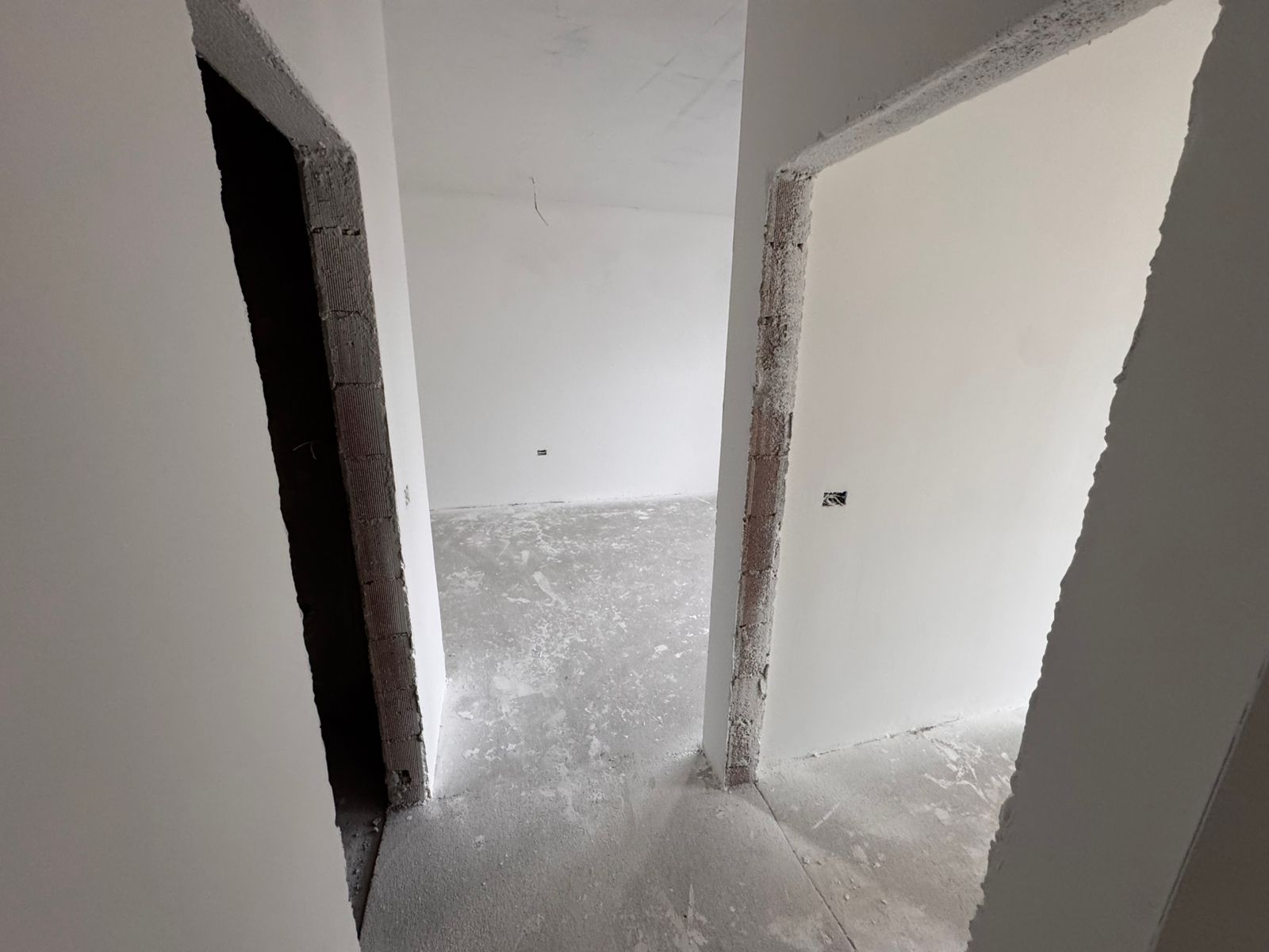 Invest in Ulcinj, Montenegro! Spacious unfinished interiors with white walls and open doorways&mdash;exclusive at montenegro-listings.me by ekosphere doo.