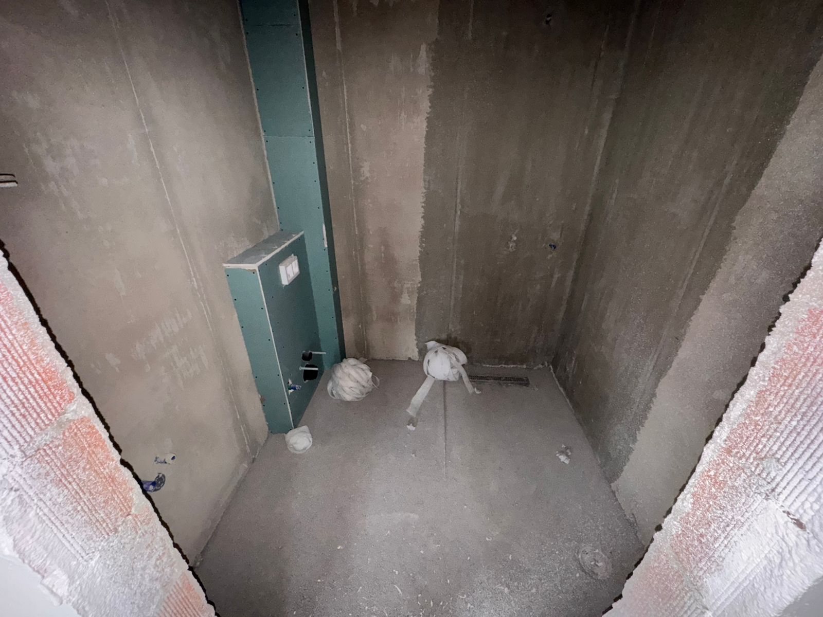 Prime Ulcinj investment: unfinished space with concrete walls, floor, plumbing, and utility setup&mdash;exclusive on montenegro-listings.me by ekosphere doo.