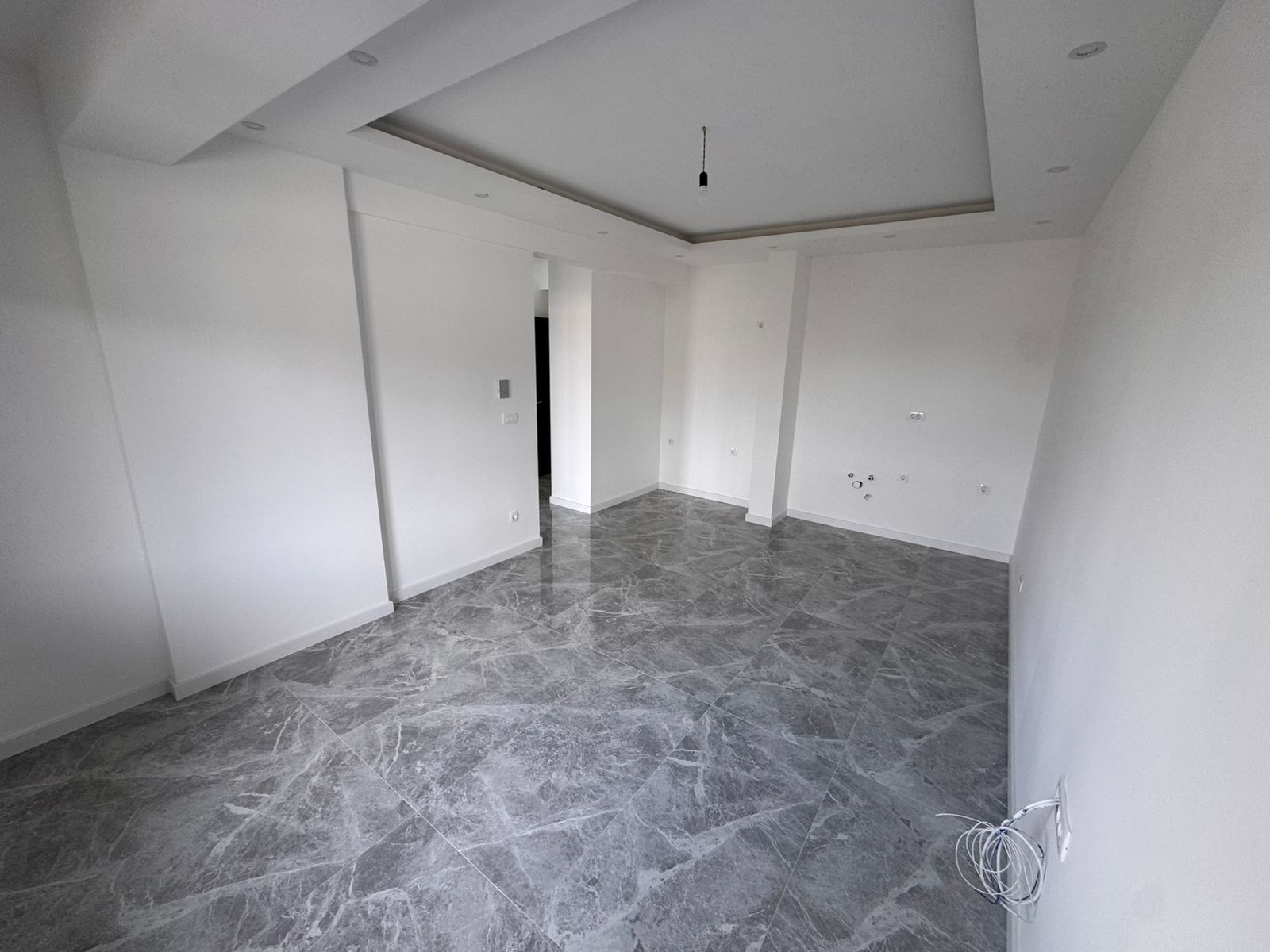 Spacious room with elegant tile flooring, ideal for investment in Ulcinj, Montenegro. Listed by montenegro-listings.me (ekosphere doo).