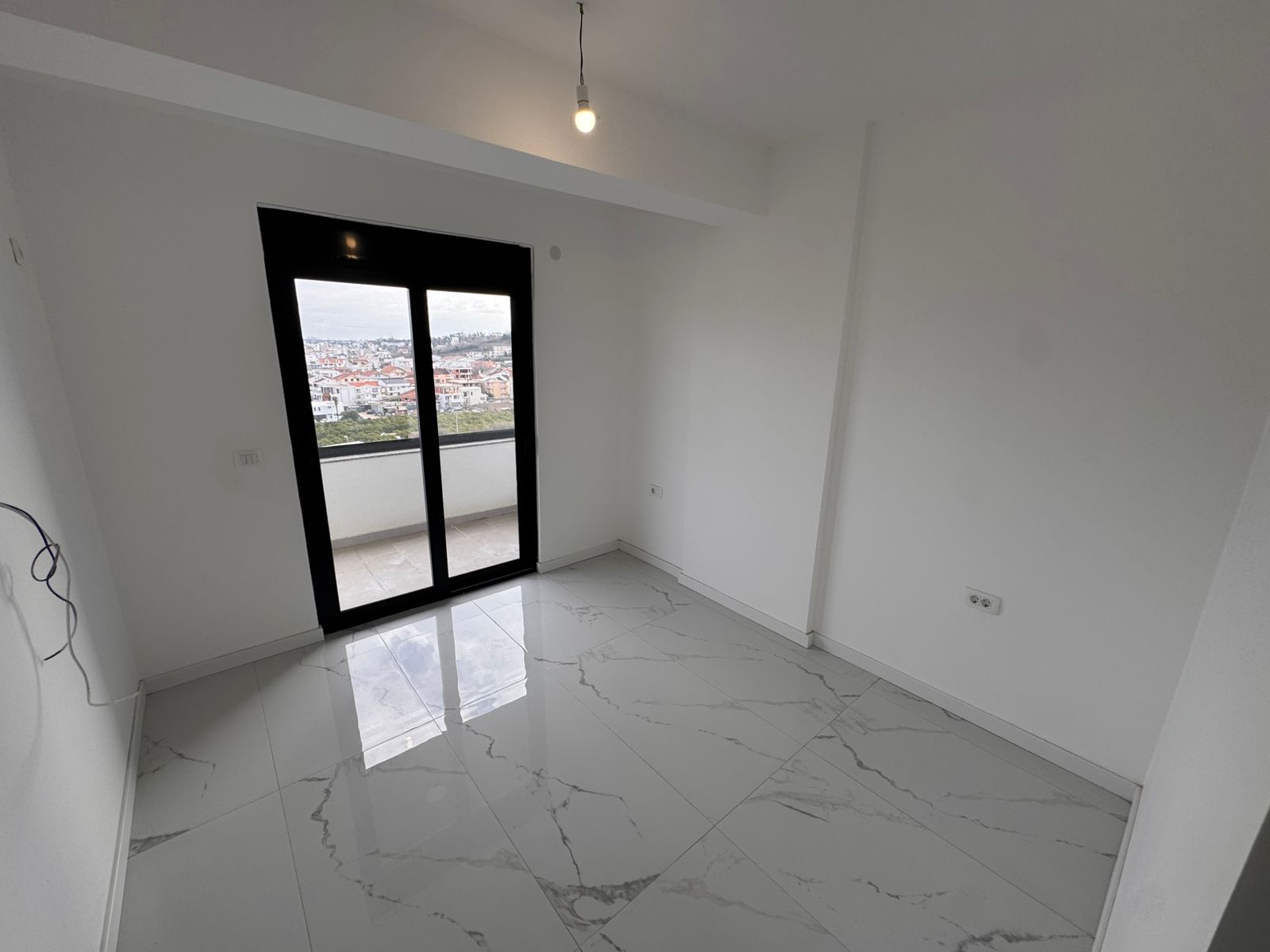 Modern, light-filled Ulcinj apartment with sleek finishes, balcony city views. Invest in Montenegro-listings.me by ekosphere doo.