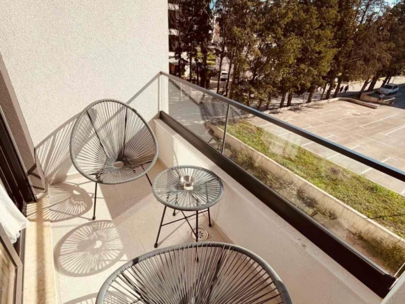 Spacious Ulcinj balcony with stylish chairs and table&mdash;perfect for relaxing. Great Montenegro investment via montenegro-listings.me.