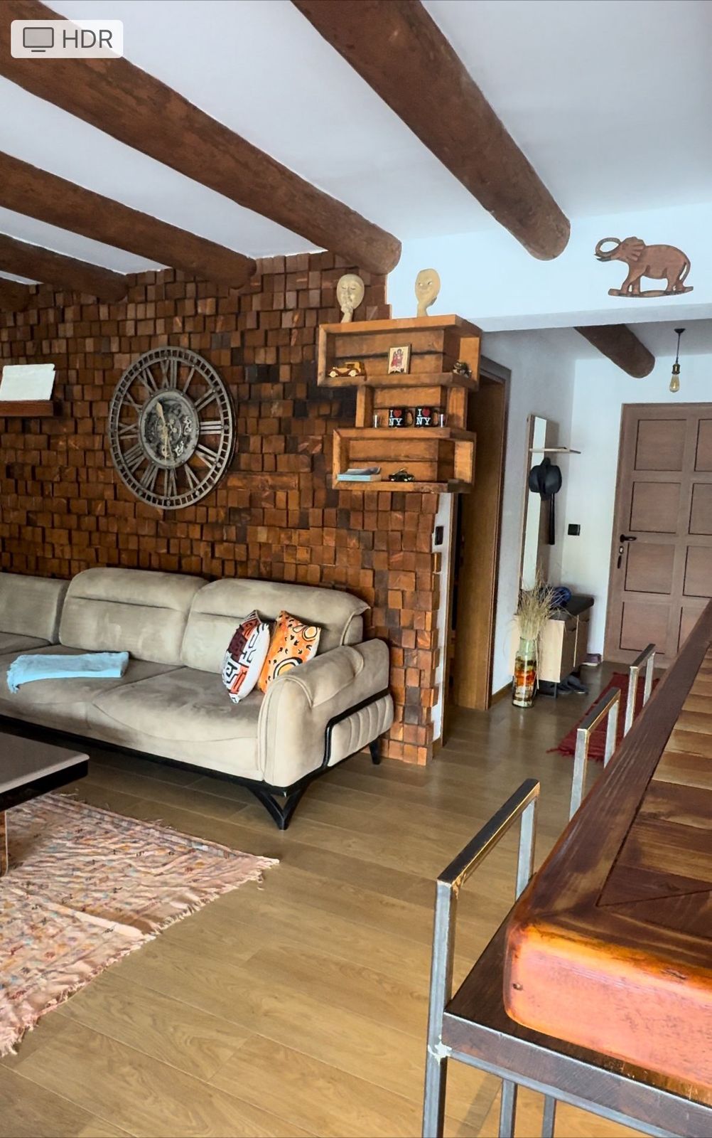 Elegant Ulcinj living room: beige sofa, vibrant decor, wood accents. Ideal Montenegro property investment. By ekosphere doo.