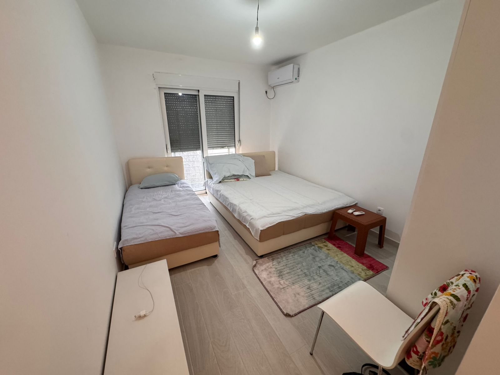 Cozy Ulcinj bedroom with single & double beds, AC, stylish decor&mdash;ideal Montenegro investment. Listed by ekosphere doo&rsquo;s project.