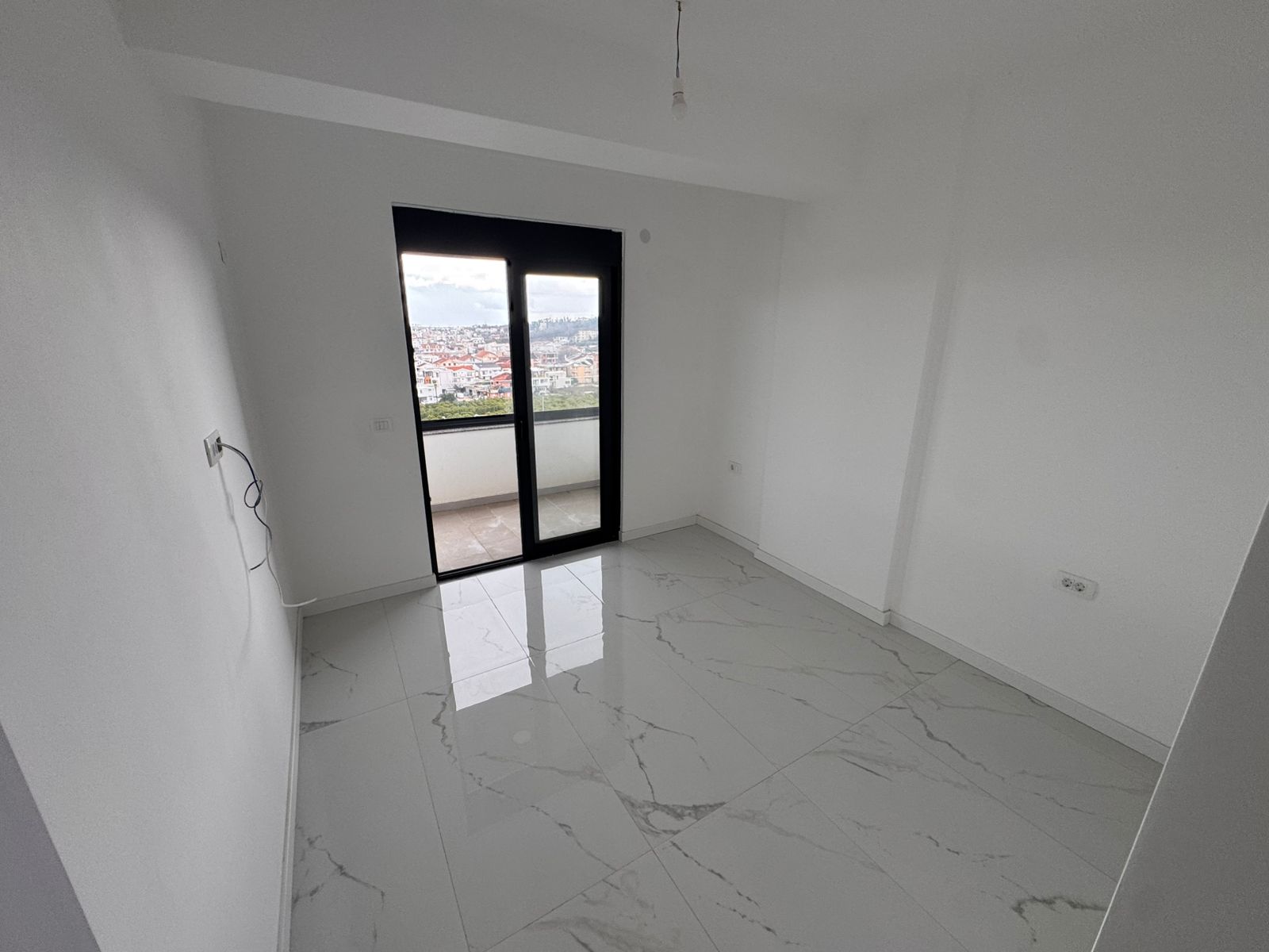 Bright, modern Ulcinj apartment with marble flooring, balcony access, city views. Exclusive listing by montenegro-listings.me/Ekosphere doo.
