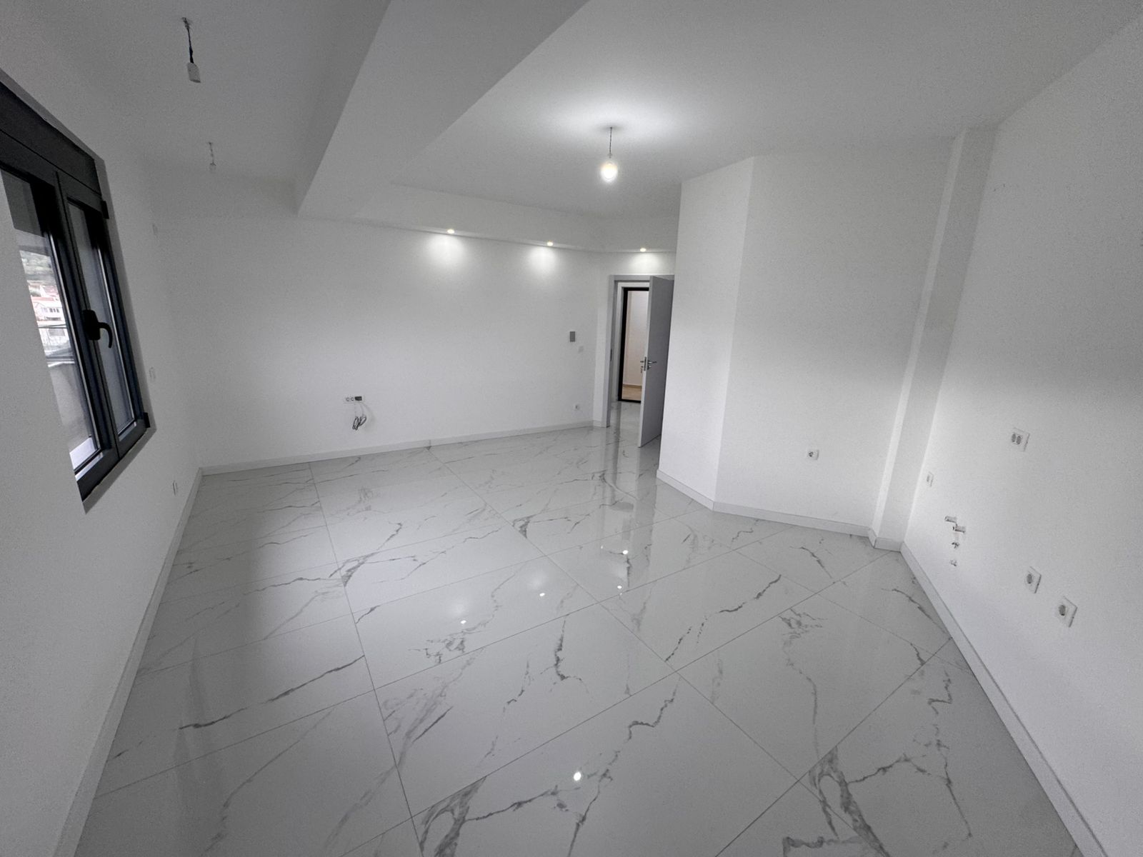 Spacious, modern Ulcinj property with white marble flooring, sleek finishes, and natural light&mdash;exclusive on montenegro-listings.me by ekosphere doo.