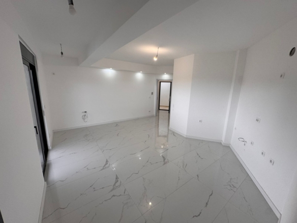 Spacious, sunlit Ulcinj property with sleek marble floors, white walls, modern lighting; invest via montenegro-listings.me by ekosphere doo.