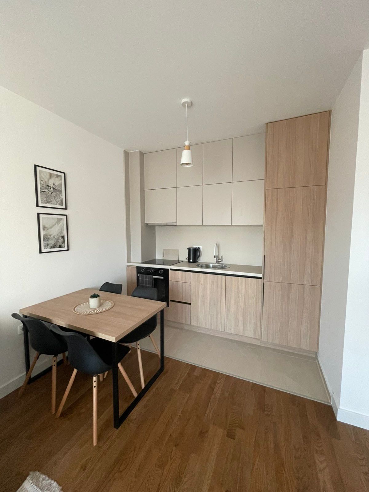 Modern Ulcinj kitchen: sleek light wood cabinets, quality appliances, dining for 4&mdash;prime Montenegro real estate investment by ekosphere doo.