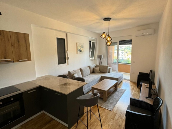 Elegant modern living area with premium finishes, open kitchen, and patio access in Ulcinj&mdash;see more at montenegro-listings.me by ekosphere doo.