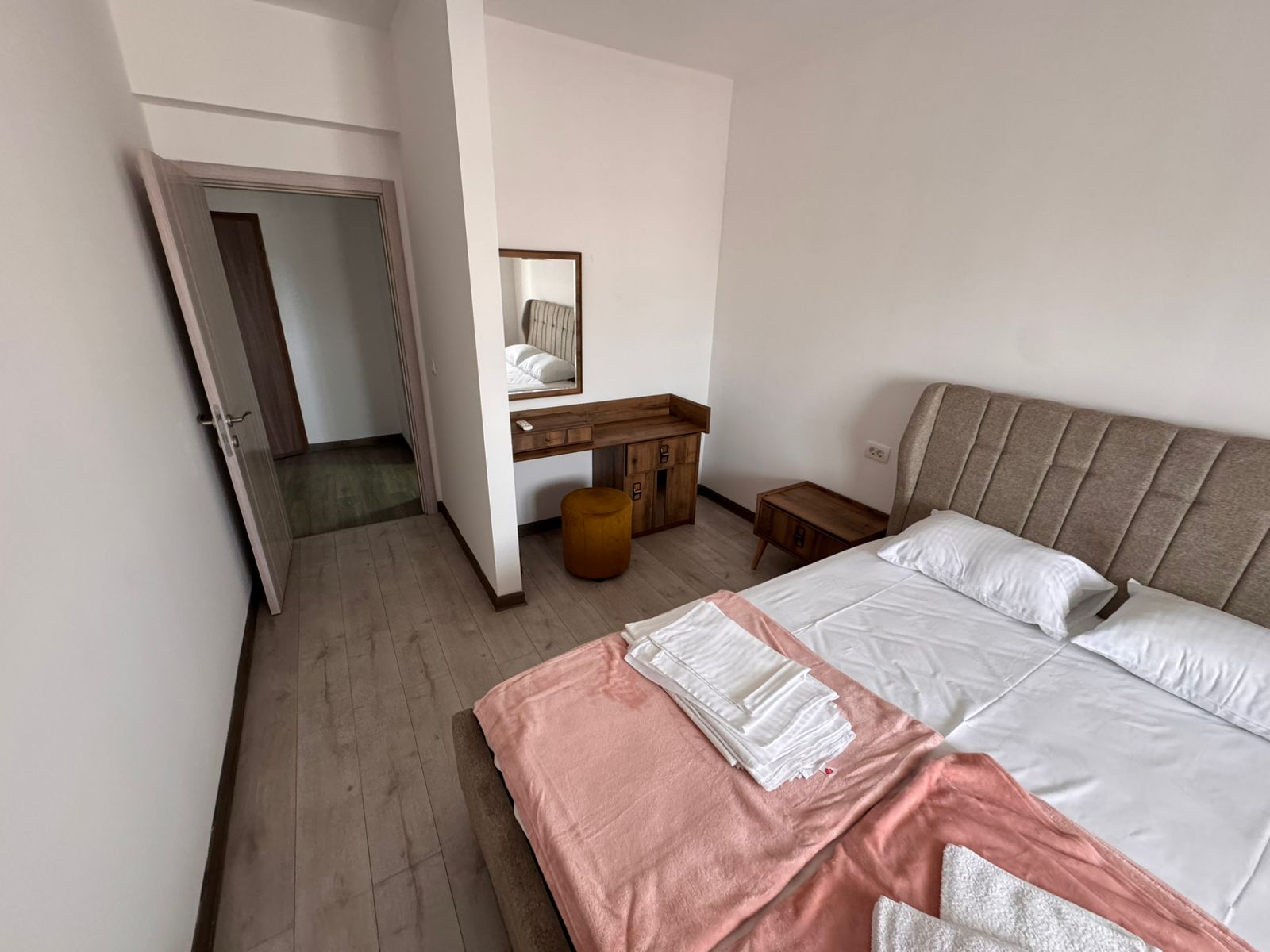 Elegant Ulcinj bedroom with double bed, premium linens, stylish furniture&mdash;ideal Montenegro investment via montenegro-listings.me.