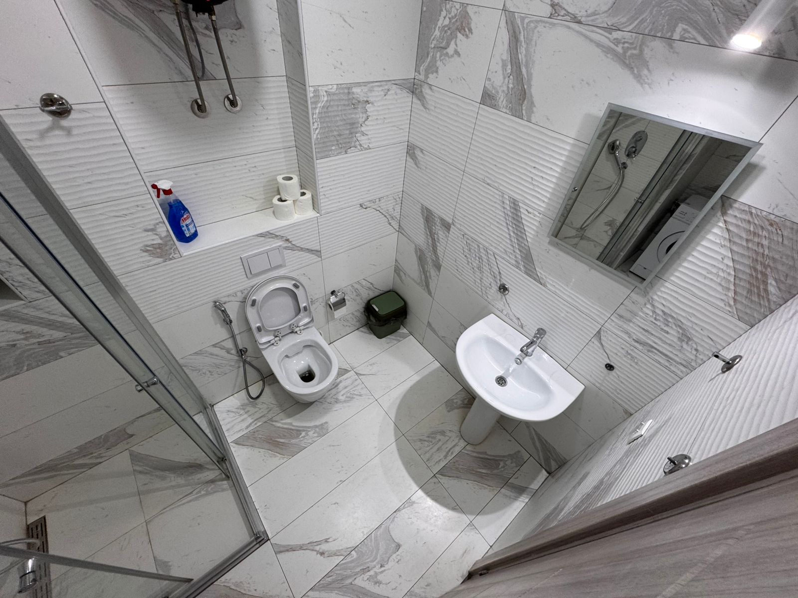 Elegant bathroom with luxurious white and gray marble tiles, quality fixtures&mdash;ideal Ulcinj property investment at montenegro-listings.me.