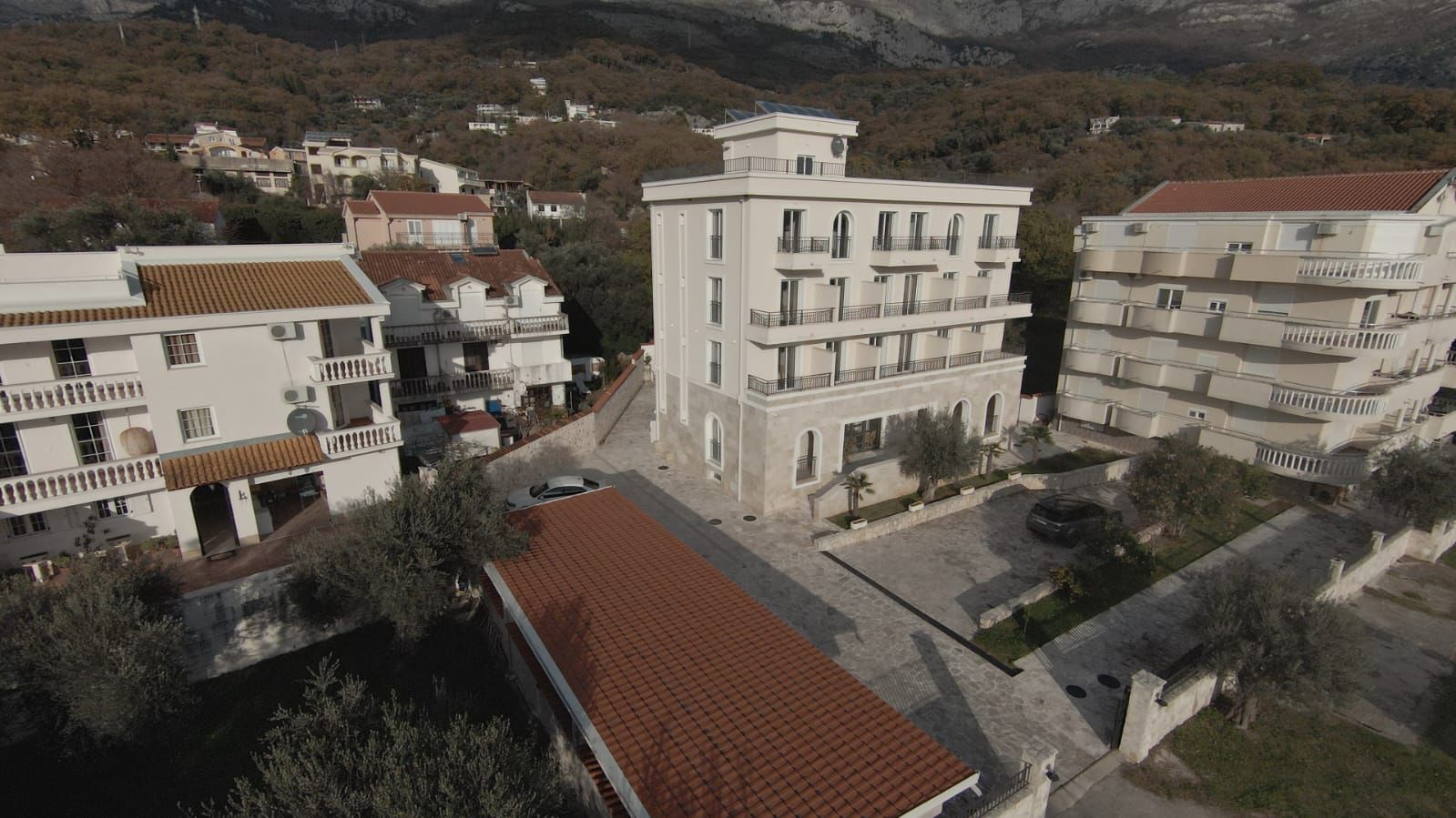 Stunning aerial view of modern white apartments in Ulcinj, Montenegro&mdash;balconies, mountain views, parking; a smart investment by ekosphere doo on montenegro-listings.me.