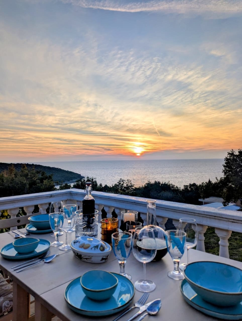 Elegant terrace in Ulcinj boasts ocean sunset views, stylish dining, and tree-lined privacy—exclusive Montenegro property by ekosphere doo.