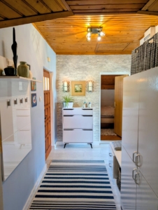 Elegant Ulcinj hallway with wooden ceiling, stylish cabinetry, modern decor & bedroom access—ideal Montenegro investment via ekosphere doo.