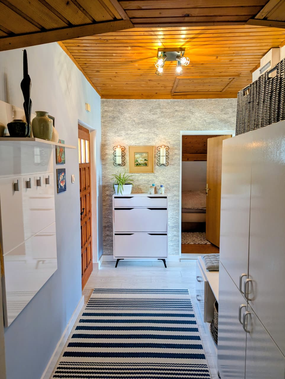 Elegant Ulcinj hallway with wooden ceiling, stylish cabinetry, modern decor & bedroom access&mdash;ideal Montenegro investment via ekosphere doo.