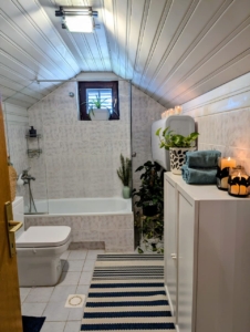 Stylish, sunlit bathroom in Ulcinj with modern tub, natural light, and elegant decor—ideal Montenegro investment property; eksophere doo project.