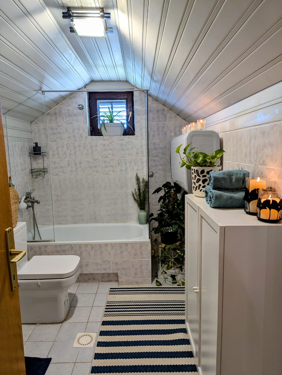 Stylish, sunlit bathroom in Ulcinj with modern tub, natural light, and elegant decor&mdash;ideal Montenegro investment property; eksophere doo project.