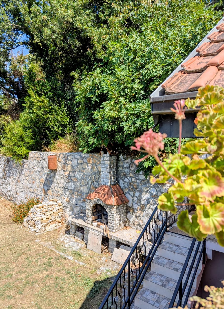 Charming stone fireplace and tiled-roof terrace in Ulcinj, Montenegro&mdash;prime real estate investment. Exclusively on montenegro-listings.me by ekosphere doo.