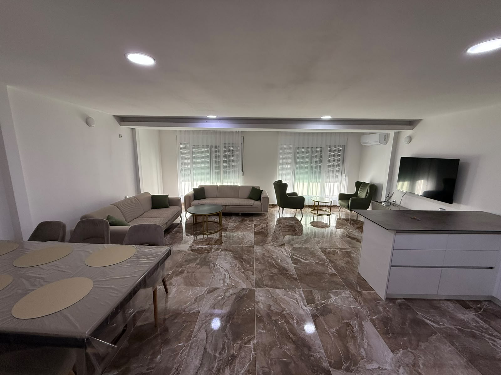 Elegant Ulcinj apartment: marble floors, sunlit living room, premium furnishings. Invest in Montenegro with montenegro-listings.me by ekosphere doo.