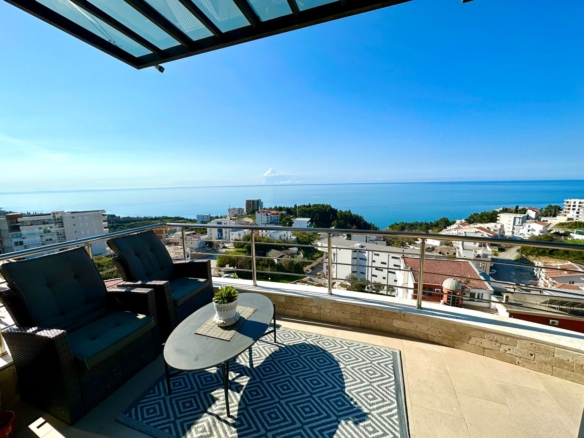 Modern balcony with glass railing offers panoramic sea and city views in Ulcinj. Top investment from montenegro-listings.me by ekosphere doo.