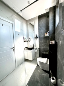 Experience luxury living in this Ulcinj bathroom featuring marble finishes, premium fixtures, and elegant modern design—only at montenegro-listings.me by ekosphere doo.