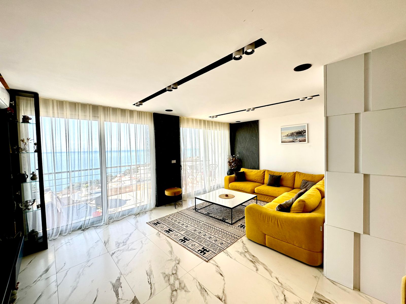 Stunning Ulcinj living room with sea views, marble floors, designer sofa&mdash;prime Montenegro investment via montenegro-listings.me by ekosphere doo.