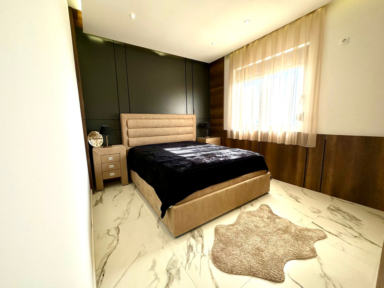 Elegant Ulcinj bedroom with marble floors, sunlit window, luxury furnishings&mdash;exclusive investment via montenegro-listings.me by ekosphere doo.