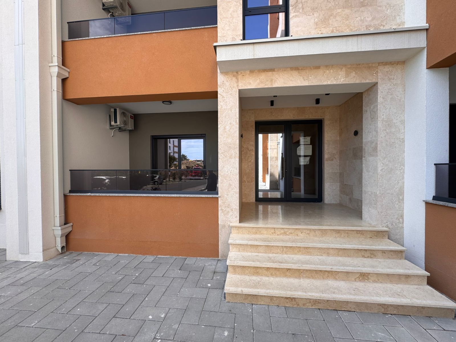 Contemporary Ulcinj property: elegant entry, beige stone steps, glass doors, luxury balcony&mdash;exclusive at montenegro-listings.me by ekosphere doo.